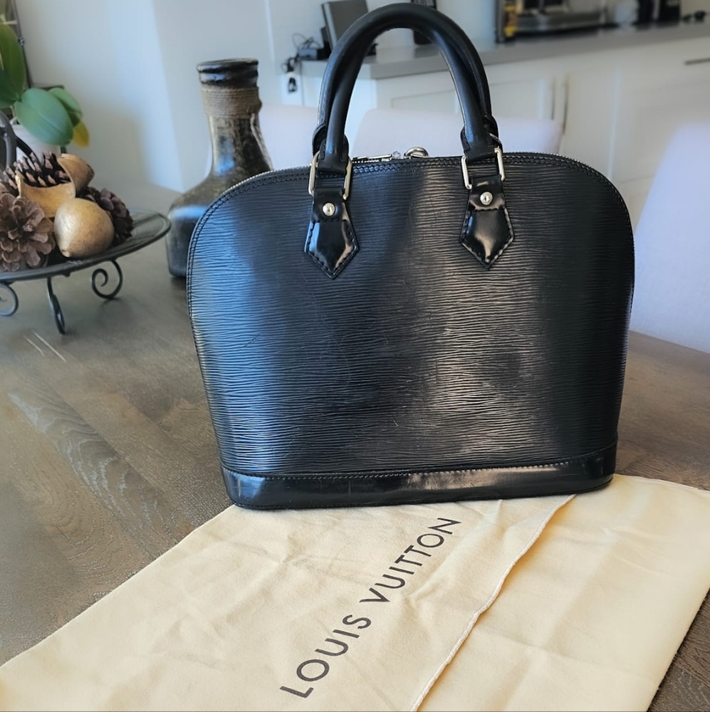 Pre-loved Louis Vuitton Alma PM Black Epi Leather with silver hardware
